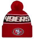 San Francisco 49ers New Era 2024 NFL Sideline Red Cuffed Pom Knit Hat product image 1, provided for visual reference and