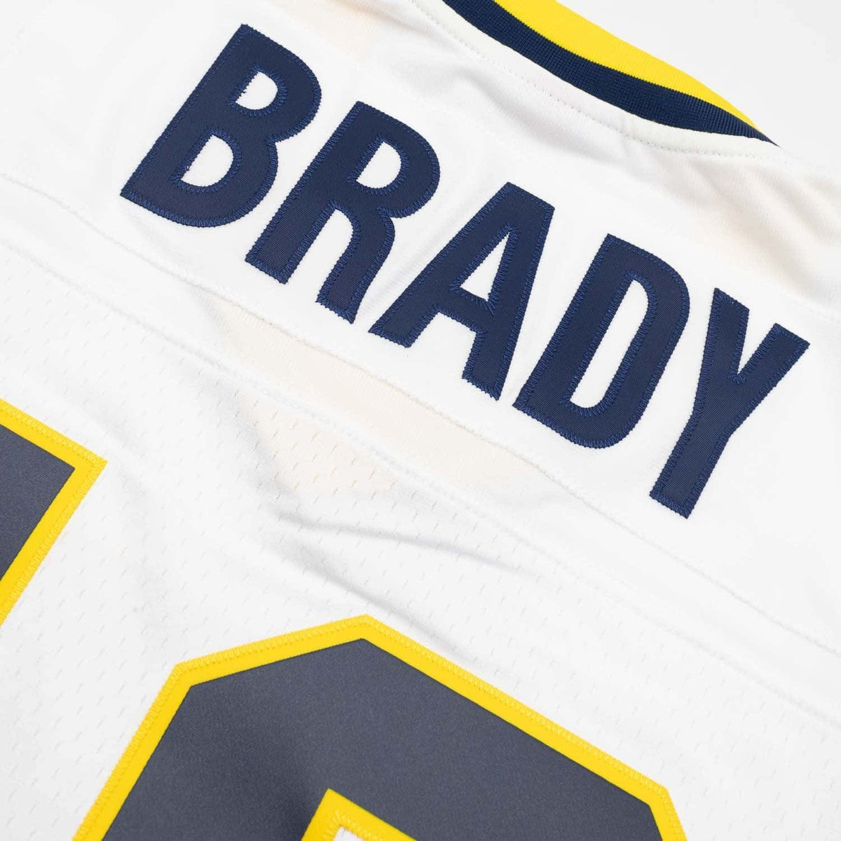 Youth Tom Brady #10 Michigan Wolverines 1999 White Mitchell & Ness Legacy NCAA Jersey product image 6, provided for visual
